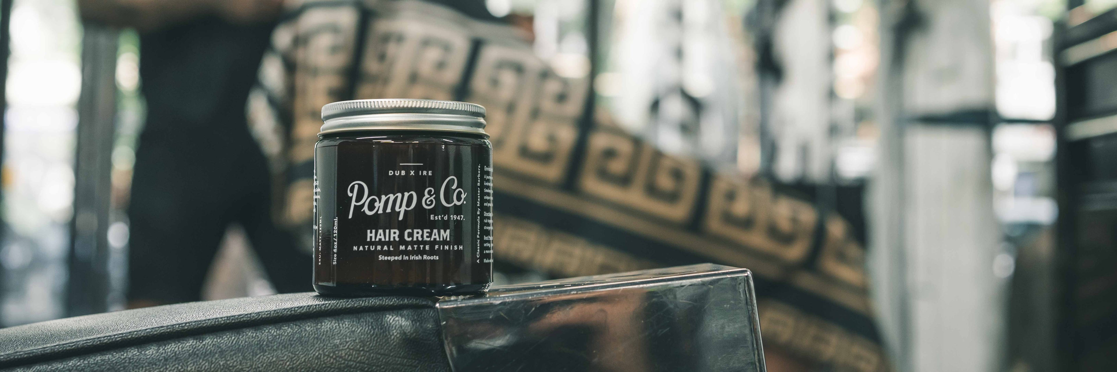 Pomp and Co Hair Cream on a Barber Chair in a Barbershop